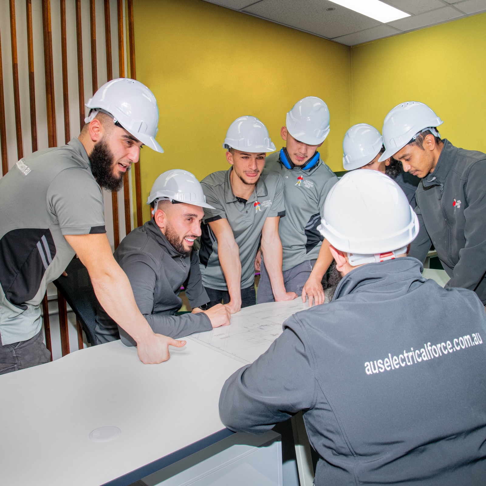 The Australian Electrical Force team reviewing a job together